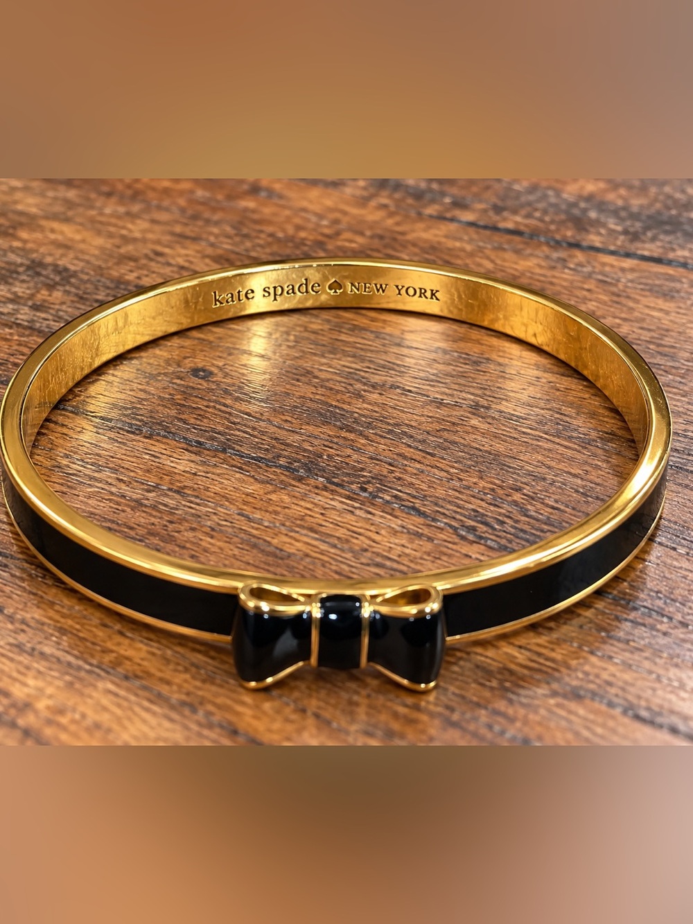 kate spade Gold-Tone Bangle with Black Enamel Bow